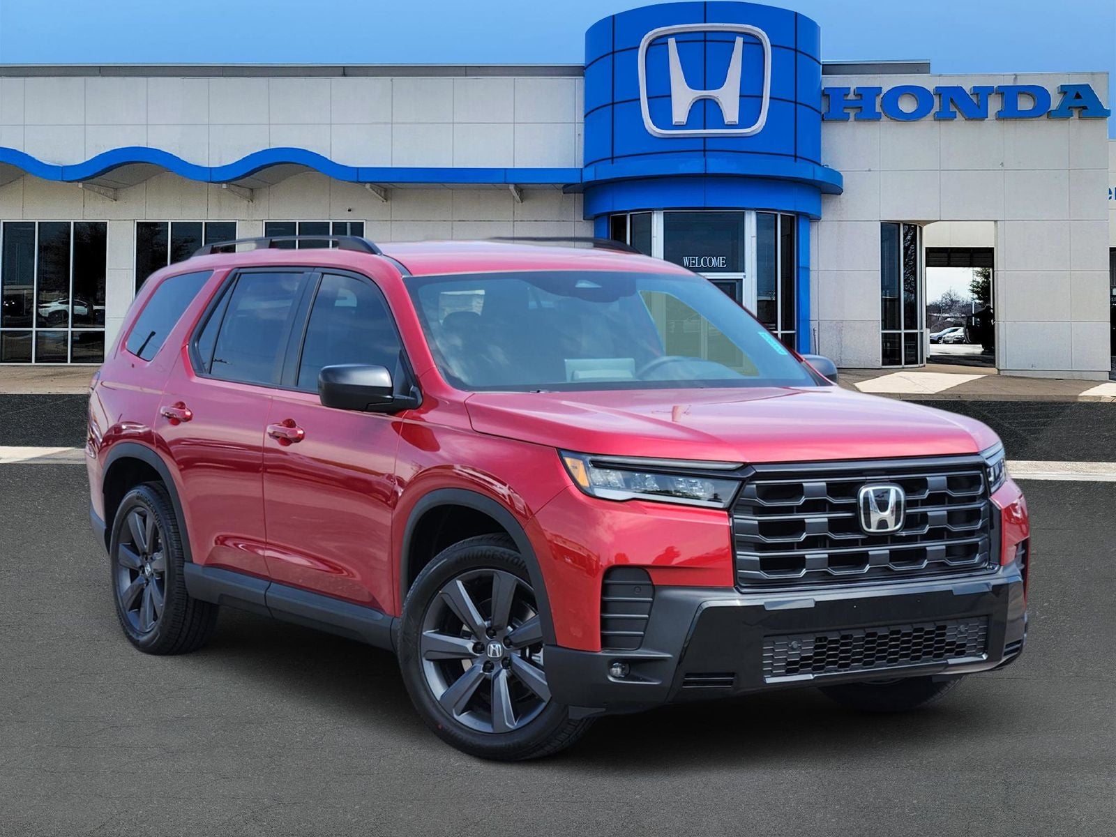 2026 Honda Pilot Sport in Radiant Red Metallic II — front three-quarter view